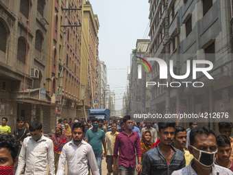 Workers coming out from different garments factories on their way home during lunch break in Narayanganj on April 24, 2019. (