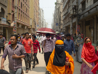 Workers coming out from different garments factories on their way home during lunch break in Narayanganj on April 24, 2019. (