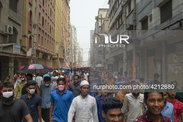 Workers coming out from different garments factories on their way home during lunch break in Narayanganj on April 24, 2019. 