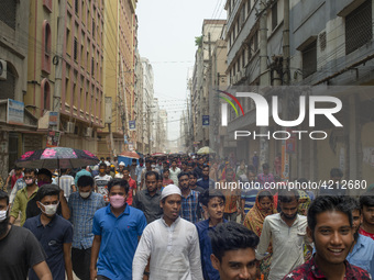 Workers coming out from different garments factories on their way home during lunch break in Narayanganj on April 24, 2019. (