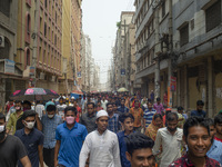 Workers coming out from different garments factories on their way home during lunch break in Narayanganj on April 24, 2019. (