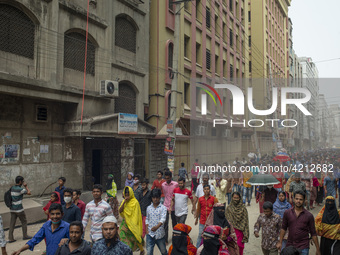 Workers coming out from different garments factories on their way home during lunch break in Narayanganj on April 24, 2019. (