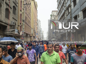 Workers coming out from different garments factories on their way home during lunch break in Narayanganj on April 24, 2019. (