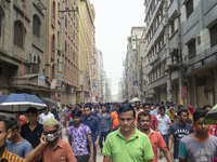 Workers coming out from different garments factories on their way home during lunch break in Narayanganj on April 24, 2019. (