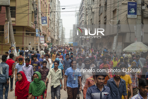 Workers coming out from different garments factories on their way home during lunch break in Narayanganj on April 24, 2019. 