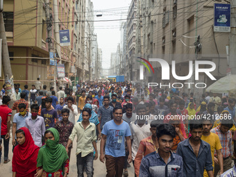 Workers coming out from different garments factories on their way home during lunch break in Narayanganj on April 24, 2019. (