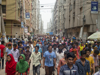 Workers coming out from different garments factories on their way home during lunch break in Narayanganj on April 24, 2019. (