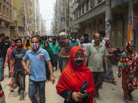 Workers coming out from different garments factories on their way home during lunch break in Narayanganj on April 24, 2019. (