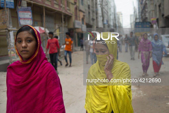 Workers coming out from different garments factories on their way home during lunch break in Narayanganj on April 24, 2019. 