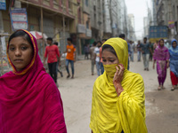 Workers coming out from different garments factories on their way home during lunch break in Narayanganj on April 24, 2019. (