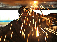 
quid iron is flowing into the prepared propeller mould at a dockyard on the bank of River Buriganga in Dhaka, Bangladesh (