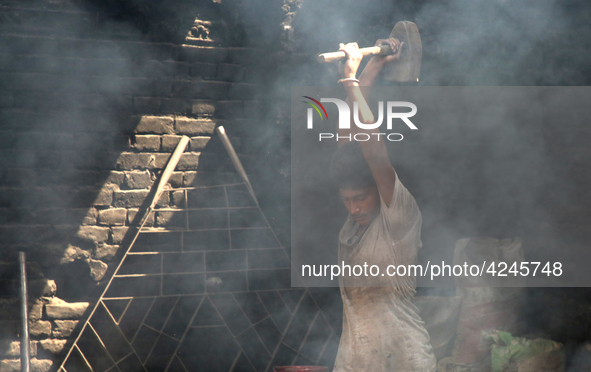  Bangladeshi worker works in a dockyard on the bank of River Buriganga, Dhaka, Bangladesh on 30 April 2019.. 