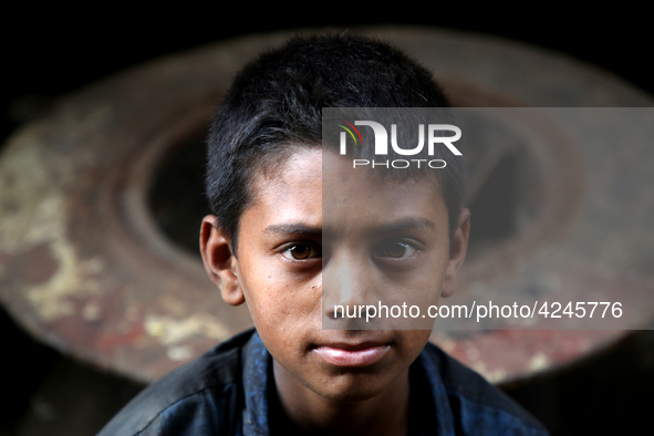 Bangladeshi worker works in a dockyard on the bank of River Buriganga, Dhaka, Bangladesh. 