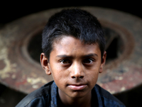 Bangladeshi worker works in a dockyard on the bank of River Buriganga, Dhaka, Bangladesh. (