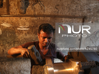 Bangladeshi worker works in a dockyard on the bank of River Buriganga, Dhaka, Bangladesh. (