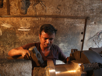 Bangladeshi worker works in a dockyard on the bank of River Buriganga, Dhaka, Bangladesh. (