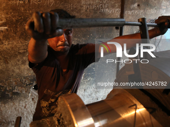 Bangladeshi worker works in a dockyard on the bank of River Buriganga, Dhaka, Bangladesh. (