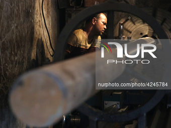 Bangladeshi worker works in a dockyard on the bank of River Buriganga, Dhaka, Bangladesh. (