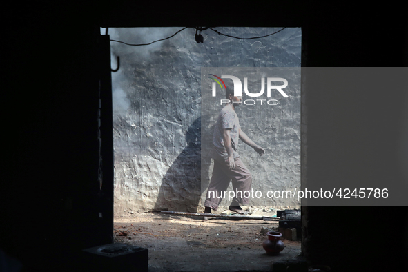 Bangladeshi worker works in a dockyard on the bank of River Buriganga, Dhaka, Bangladesh. 