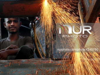 Bangladeshi worker works in a dockyard on the bank of River Buriganga, Dhaka, Bangladesh. (