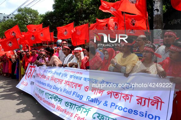 Bangladeshi garment workers and other labor organization activists take part in a rally to mark May Day or International Workers' Day in Dha...