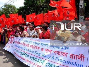 Bangladeshi garment workers and other labor organization activists take part in a rally to mark May Day or International Workers' Day in Dha...