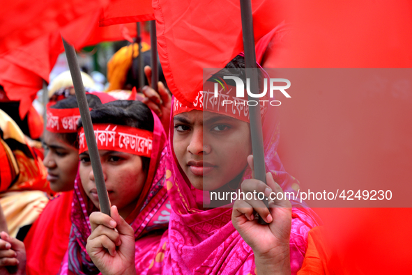 Bangladeshi garment workers and other labor organization activists take part in a rally to mark May Day or International Workers' Day in Dha...