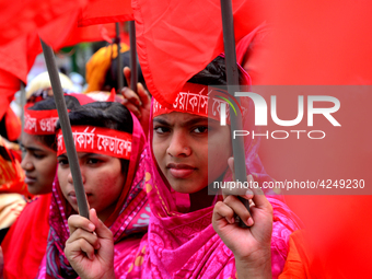 Bangladeshi garment workers and other labor organization activists take part in a rally to mark May Day or International Workers' Day in Dha...