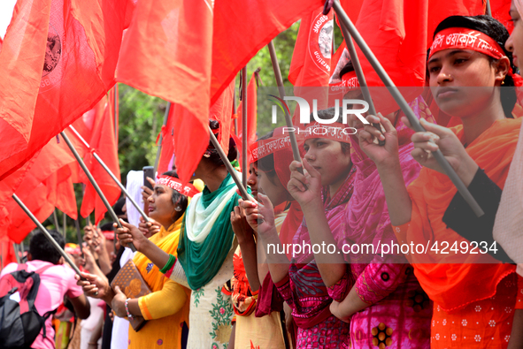 Bangladeshi garment workers and other labor organization activists take part in a rally to mark May Day or International Workers' Day in Dha...