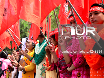 Bangladeshi garment workers and other labor organization activists take part in a rally to mark May Day or International Workers' Day in Dha...