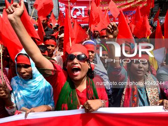 Bangladeshi garment workers and other labor organization activists take part in a rally to mark May Day or International Workers' Day in Dha...