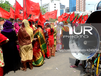 Bangladeshi garment workers and other labor organization activists take part in a rally to mark May Day or International Workers' Day in Dha...