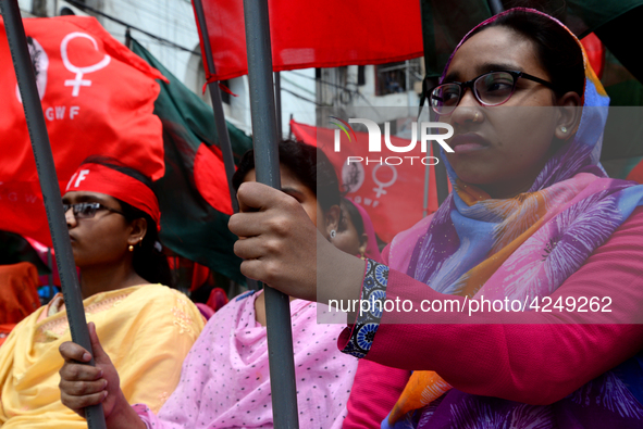 Bangladeshi garment workers and other labor organization activists take part in a rally to mark May Day or International Workers' Day in Dha...