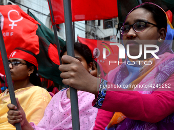 Bangladeshi garment workers and other labor organization activists take part in a rally to mark May Day or International Workers' Day in Dha...