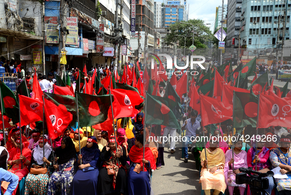 Bangladeshi garment workers and other labor organization activists take part in a rally to mark May Day or International Workers' Day in Dha...