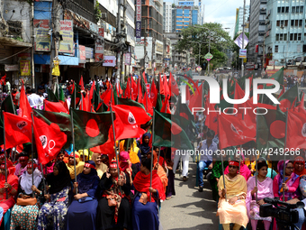 Bangladeshi garment workers and other labor organization activists take part in a rally to mark May Day or International Workers' Day in Dha...