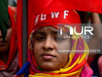 Bangladeshi garment workers and other labor organization activists take part in a rally to mark May Day or International Workers' Day in Dha...