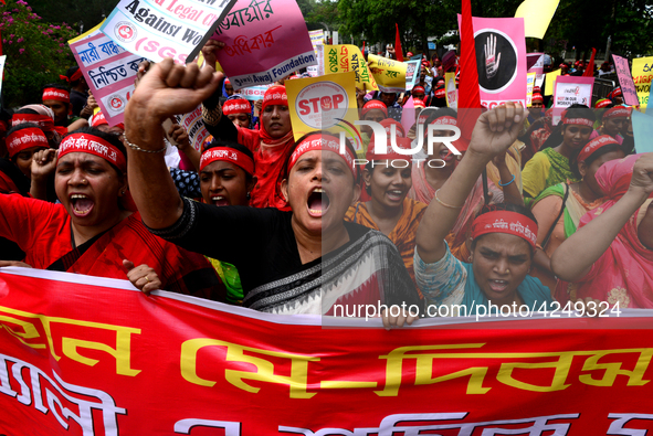 Bangladeshi garment workers and other labor organization activists take part in a rally to mark May Day or International Workers' Day in Dha...