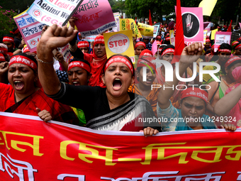 Bangladeshi garment workers and other labor organization activists take part in a rally to mark May Day or International Workers' Day in Dha...