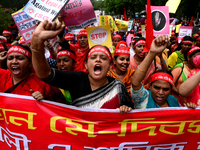 Bangladeshi garment workers and other labor organization activists take part in a rally to mark May Day or International Workers' Day in Dha...