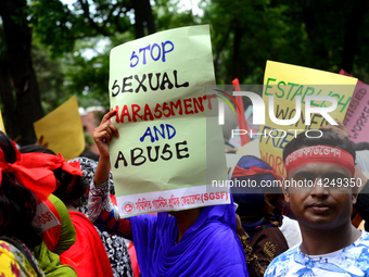 Bangladeshi garment workers and other labor organization activists take part in a rally to mark May Day or International Workers' Day in Dha...