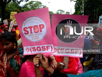 Bangladeshi garment workers and other labor organization activists take part in a rally to mark May Day or International Workers' Day in Dha...