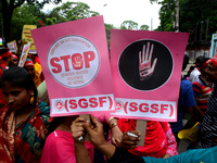 Bangladeshi garment workers and other labor organization activists take part in a rally to mark May Day or International Workers' Day in Dha...