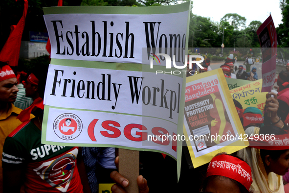 Bangladeshi garment workers and other labor organization activists take part in a rally to mark May Day or International Workers' Day in Dha...