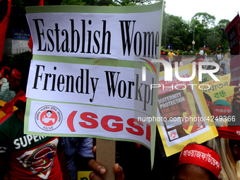 Bangladeshi garment workers and other labor organization activists take part in a rally to mark May Day or International Workers' Day in Dha...