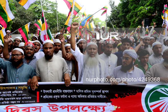 Bangladeshi garment workers and other labor organization activists take part in a rally to mark May Day or International Workers' Day in Dha...