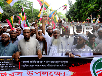 Bangladeshi garment workers and other labor organization activists take part in a rally to mark May Day or International Workers' Day in Dha...