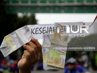 Thousand of labours from various labour organizations commemorating the International Labour Day or knows as May Day in Jakarta on May 1, 20...