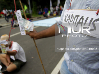 Thousand of labours from various labour organizations commemorating the International Labour Day or knows as May Day in Jakarta on May 1, 20...