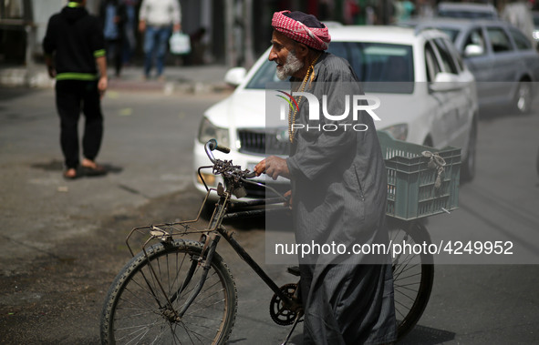 A Palestinian man walks in the street, in Gaza City  May 1, 2019.
 